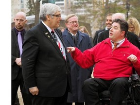 Alberta Premier Dave Hancock (left) speaks with Alberta MLA Kent Hehr in April. (Edmonton Journal/Files)