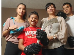 Amanda Stevenson, second from right, says members of her family, from left, 16-year-old Alexa, 10-year-old Dyllan and 17-year-old Devin have adopted active lives because of taking phys-ed in school.