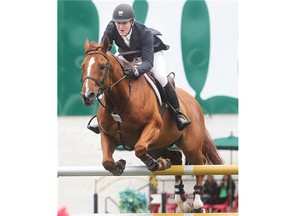 American McLain Ward rides Rothchild to victory in the CP Grand Prix event at the Spruce Meadows Continental on Sunday.