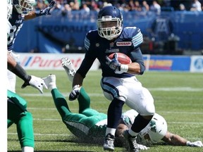 Anthony Coombs of the Toronto Argonauts breaks a tackle and keeps running with the ball during a CFL game against the Saskatchewan Roughriders last weekend. He could see more opportunity against the Calgary Stampeders on Saturday with slotback Andre Durie lost with a broken clavicle.