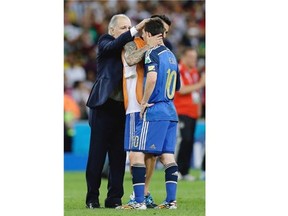 Argentina’s head coach Alejandro Sabella, left, comforts Lionel Messi after the World Cup final soccer match between Germany and Argentina at the Maracana Stadium in Rio de Janeiro on July 13.