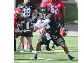 Aspiring Calgary Stampeders quarterback Bryant Moniz takes part in training camp on Tuesday.