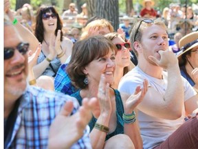 The audience applauds during the Torch and Twang workshop at the Calgary Folk Music Festival on Sunday.