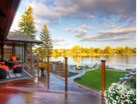 An autumn view across Lake Bonavista from the upper mahogany deck of the Lake Bonavista Estates home renovated by Ultimate Renovations. Lake Bonavista the community evolved out of the building of the lake itself in 1967.