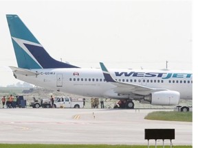 A blown tire on a WestJet plane that was taking off had passengers concerned as they felt their plane skid sideways at the Calgary International Airport’s new runway in Calgary on July 16, 2014.