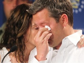 Rod O’Brien breaks down alongside his wife Jennifer as the couple address a press conference regarding their missing son Nathan.