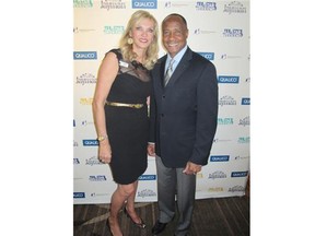 Big Brothers Big Sisters of Calgary president and CEO Trish Bronsch posed for a photo at the ninth annual All-Star Gala with guest of honour and keynote speaker Lynn Swann, a former NFL all-star.