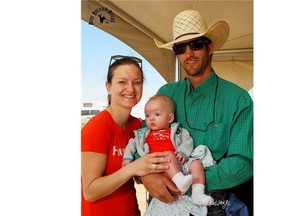 Bull rider Aaron Roy, with his wife Hallie and baby boy Axel, is ready to begin riding again after suffering a fractured vertebrae and broken jaw when he was stomped by a bull at the 2013 Stampede.