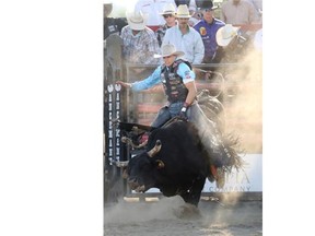 Bull rider Jory Markiss held on as he rode Canadian Diesel during the Ranchman’s Renegades Smithbilt Bullbustin 2014 on Canada Day.