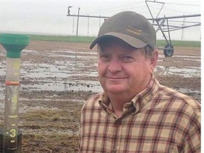 Gary Stanford, standing in his waterlogged Magrath-area field on Wednesday, says this is the most rain he's seen on his land in "many, many years."