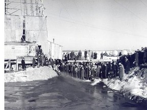 Spectators watch oil explode from Leduc No. 1 well on Feb. 13, 1947.