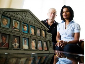Ann and Byron Grant of Oakville, Ont., with photographs of their son Evan Horkoff. Horkoff was killed in a workplace accident in Alberta in 2011. His employer was charged in relation to his death and will appear in court in September. (Glenn Lowson, For the Calgary Herald)