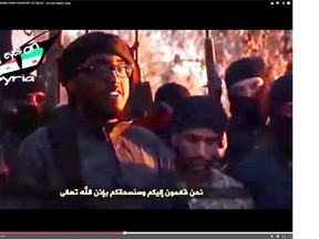 Calgarian Farah Shirdon is seen in this recent ISIL video burning his Canadian passport and issuing threats to Canada and the U.S. (YouTube footage)