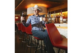 Calgary Herald reporter Jason Markusoff enjoys an early morning beer at the Metropolitan Grill.