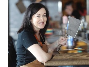 Barbara Spain poses at the bar at Cleaver, her new 17th Avenue restaurant that opened 3 weeks ago, on Friday August 15, 2014.