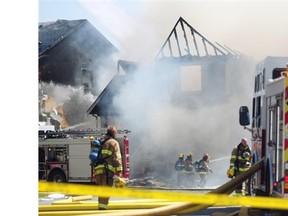 Calgary firefighters battle a two-alarm residential fire in New Brighton.
