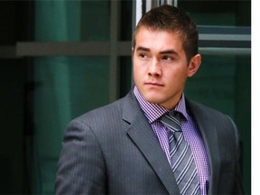 Calgary Flames prospect Michael Ferland leaves the Calgary Courts Centre during a break in his assault trial on Monday.
