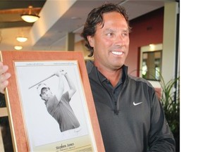 Calgary golfer Stephen Ames holds his plaque after being inducted into the Canadian Golf Hall of Fame on Tuesday at Canyon Meadows Golf and Country Club. He is competing for the first time in the Shaw Charity Classic, the tournament he helped bring to Calgary.