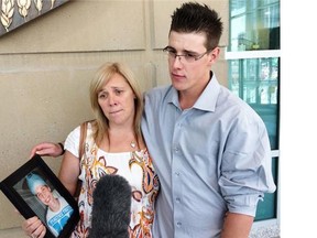 CALGARY, AB; JUNE 24, 2014   — Mother Debbie Hogarth and son Ryan Hogarth, 22, on Tuesday, June 24, 2014, after sentencing arguments on manslaughter for Byron Blanchard in connection with Aug. 21, 2012, stabbing death of Joshua Hogarth, 18.(Darryl Slade/Calgary Herald) For City story by Darryl Slade