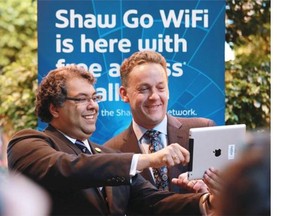 Calgary Mayor Naheed Nenshi and Shaw Communications CEO Brad Shaw officially launch the city’s public Wi-Fi network Tuesday at the Devonian Gardens by taking a “selfie” photo.