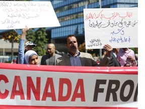 Calgary Muslims during a rally against terrorism by the group Islamic State of Iraq and the Levant (ISIL, also known as ISIS) in front of City Hall on June 21, 2014 in Calgary