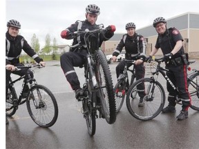 Calgary Police bike unit members Sgt. Chris Gauvin, from left, Cst. Ryan Hopping, Cst. Brian Shalley and Insp. Scott Boyd will be part of a team patrolling areas such as Fish Creek Park that are difficult to cover with patrol cars.