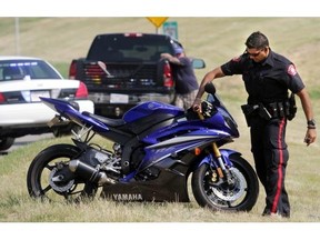 Calgary Police investigate a collision between a motorcycle and pickup truck on the northbound ramp from 16th Avenue to Deerfoot Trail Friday morning. It is the latest in a string of crashes involving motorcycles this week.