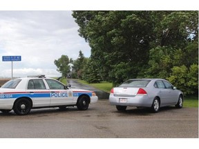 Calgary Police investigate a shooting near Balzac on Wednesday.