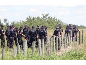 Calgary Police and RCMP members made their way into the massive grid search area near the Airdrie acreage in connection with the disappearance of Nathan O’Brien, 5, Alvin Liknes and Kathryn Liknes on July 6, 2014.
