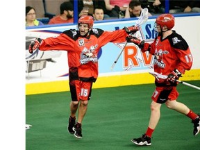Calgary Roughnecks star Shawn Evans, left, celebrates with Curtis Dickson after scoring on the Edmonton Rush last Friday. The Riggers are now preparing for the Champions Cup final.