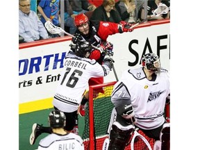 Calgary Roughnecks transition ace Geoff Snider caught some air as he was pushed by Edmonton Rush defenceman Chris Corbeil during a March meeting. Snider missed the playoff series against Edmonton with an injury.