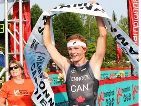 Calgary’s Russell Pennock crosses the finish line during the Canadian Junior National Championship Triathalon earlier this summer. After winning all four events on the national junior circuit, he gets an upgrade in the test at the World Triathlon Grand Final in Edmonton on Friday.