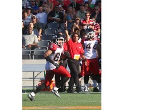 Calgary’s Sederrik Cunningham returns a punt for a touchdown against the Ottawa Redblacks on Sunday. It was a dynamic breakout performance for the former Green Bay Packer as he also scored a touchdown on a 20-yard end around in the fourth quarter.