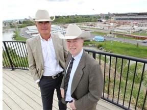 Calgary Stampede president Bob Thompson, left, and CEO Vern Kimball, right, on Scotchman’s Hill overlooking the Stampede Grandstand on May 29, 2014. Thanks to an army of volunteers, the Stampede went ahead last year after being flooded.