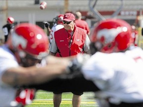 Calgary Stampeders defensive co-ordinator Rich Stubler watches the players drill on the first day of Stampeder training camp Sunday at McMahon Stadium.