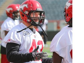 Calgary Stampeders linebacker Max Caron talks along the sidelines during practice on Thursday.