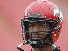 Calgary Stampeders wide receiver Maurice Price looks sombre in the rain at McMahon Stadium on Friday. He was one of the most outspoken critics of the CFL/CFLPA collective bargaining agreement.