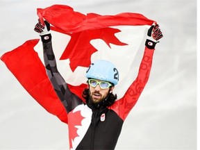 Canada’s Charles Hamelin celebrates his gold medal victory in the men’s 1500 metre short track speedskating final at the Sochi Winter Olympics. Hamelin will be in Calgary this week, along with hundreds of other Sochi athletes. (Paul Chiasson/THE CANADIAN PRESS)