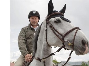 Canadian equestrian star Eric Lamaze rides Clever Lady at Spruce Meadows on Tuesday. The National tournament, the first major event on the Spruce Meadows 2014 calendar, gets going on Wednesday.