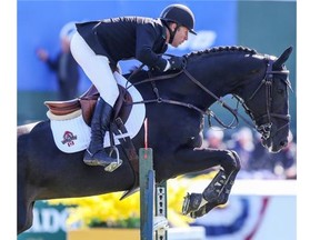 Canadian Eric Lamaze rides Zigali PS for a 15th place finish at the Spruce Meadows Cana Cup on Thursday. Earlier in the day, he won the ATCO Structures & Logistics Cup aboard Fine Lady 5.