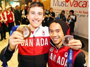 Canadian Olympic Speed Skater Denny Morrison, with teammate Gilmore Junio, who gave up his spot so Morrison could compete and ultimately win a silver medal in the Sochi Olympics. (Calgary Herald/Files)