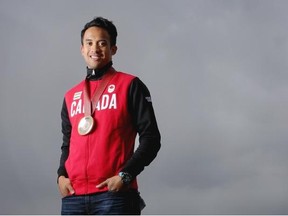 Canadian Olympic speedskater Gilmore Junio poses with the crowd-funded medal he was given. The Calgarian soared into Olympic hearts after giving up his spot in the men’s 1,000 metres in Sochi so that teammate Denny Morrison could race and win a silver medal.