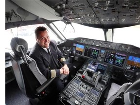 Captain Murray Strom shows off his cockpit in Air Canada’s new Dreamliner Boeing 787, as Calgarians flock to see the new runway at Calgary International Airport on Sunday.