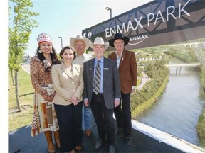 Carly Weasel Child, Stampede Indian Princess 2014, from left, Gianna Manes, president and chief executive officer ENMAX, Greg Melchin, board chair ENMAX, Vern Kimball, chief executive officer Calgary Stampede, and Steve Snyder, chair Calgary Stampede Foundation Campaign, pose by the newly announced ENMAX Park at the Stampede grounds.