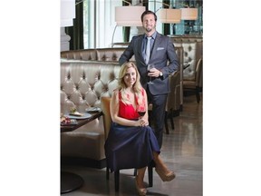 Chicago Chophouse owners, Adam Dalsin, right, and Victoria Harris, left, pose in their new downtown location in Calgary on Wednesday, Aug. 6, 2014.
