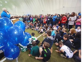 Children and parents gather for the ceremony marking the 10th birthday of the Calgary West Soccer Centre, its five-year lease extension and $500,000 in grants toward facility upgrades.