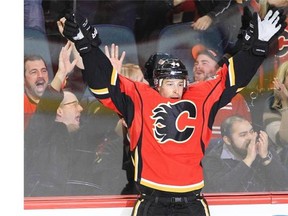 Chris Butler celebrates a goal as a member of the Calgary Flames last season. The St. Louis native is returning home, signing with the Blues on Wednesday.