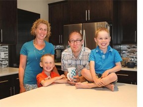 Christina and Erik Van den Eyndyn with sons Kaden, 7, at left, and Carter, 5. They bought a 2,400-square-foot, three-bedroom home in Kinniburgh.