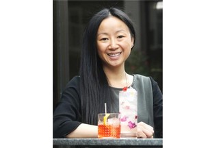 Christina Mah shows off a pair of drinks — a low-alcohol Sloe Sipper and a non-alcoholic Virgin Blossom Cooler — at the Raw Bar at Hotel Arts in Calgary.