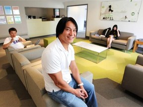 Hostelling International Calgary City Centre Manager Jason Wong sat in the main lobby of the newly rebuilt hostel on June 3, 2014. The hostel has just reopened after 11 months of rebuilding from the damage caused during last years floods.